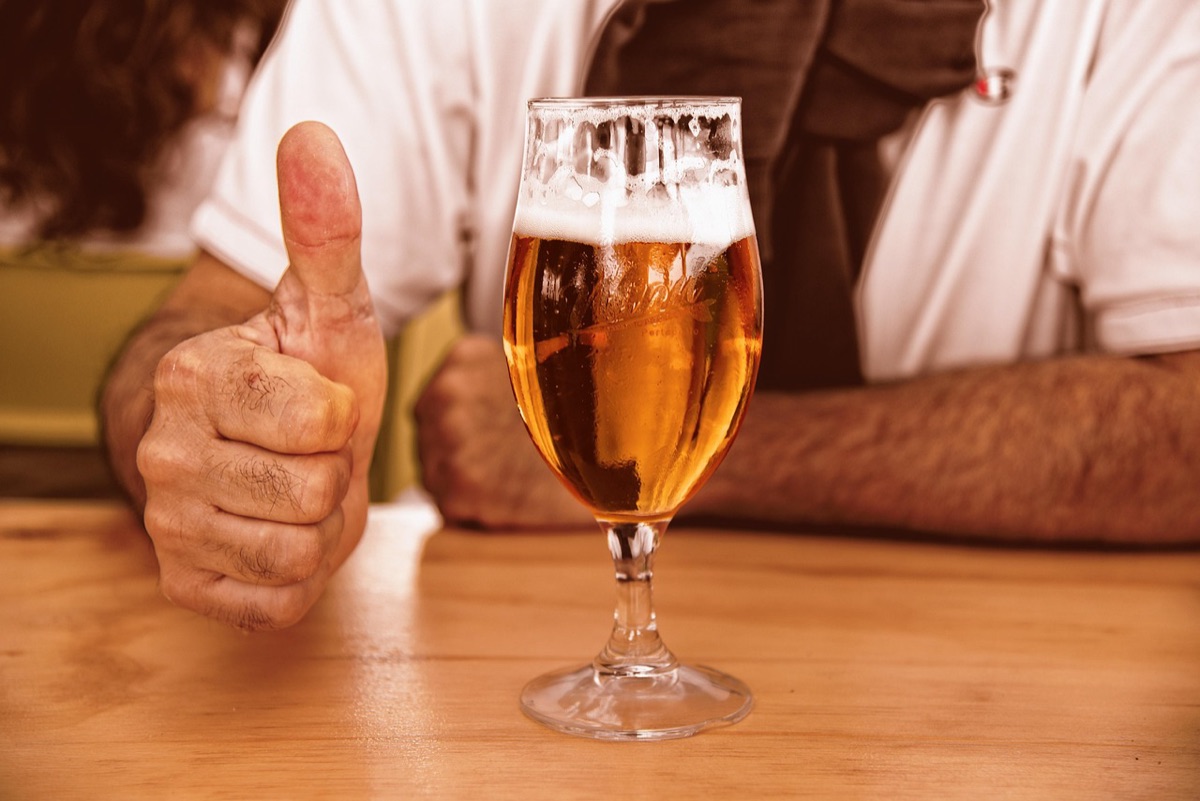 Beer can set on wooden table