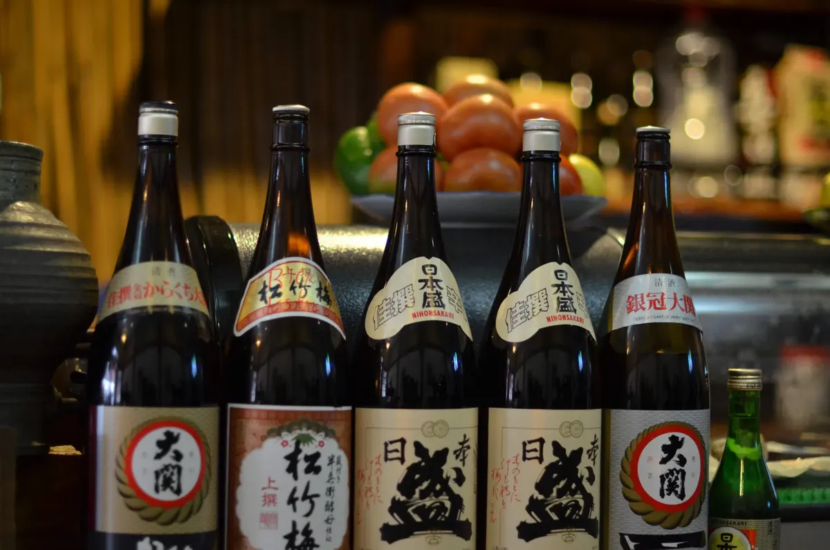 Array of traditional Japanese sake bottles displayed at a restaurant in Makati's Little Tokyo.