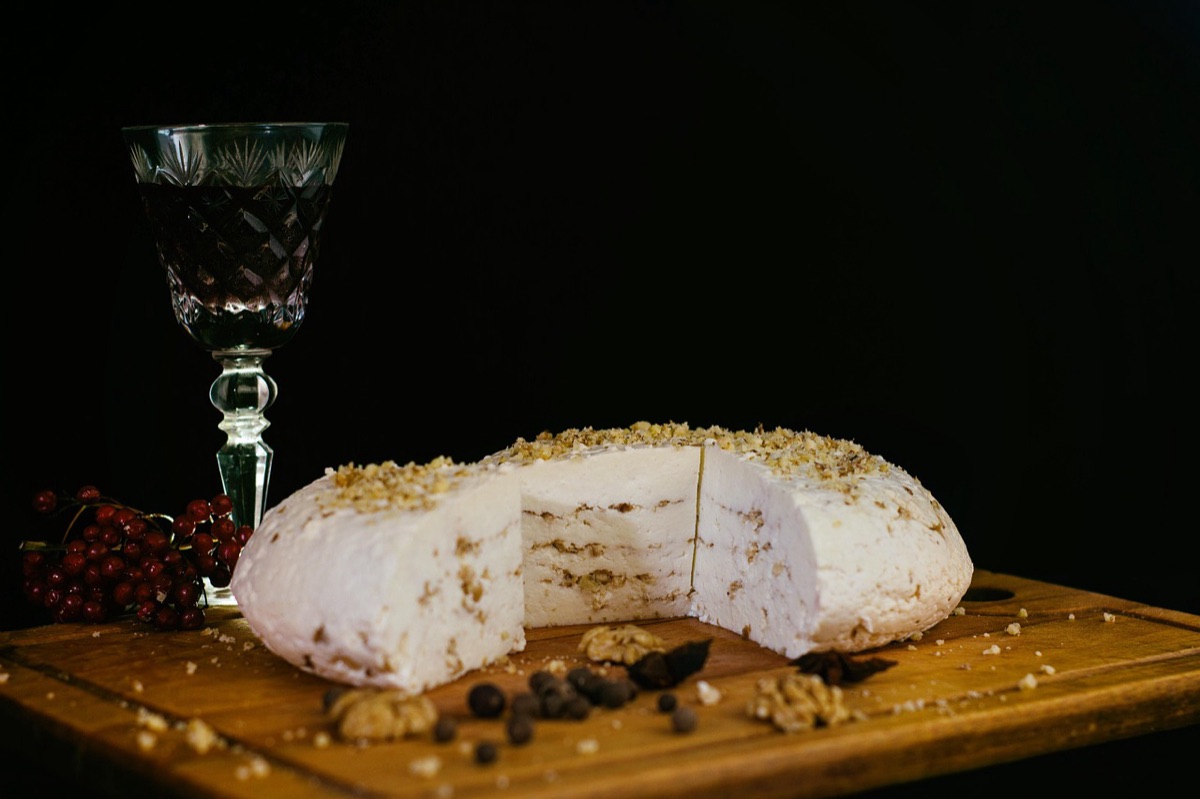 Wine and cheese plate on wooden table