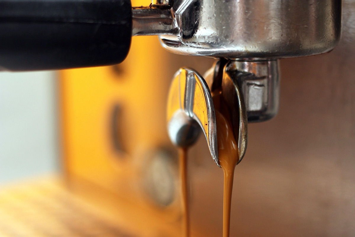 Barista pouring whiskey into glass